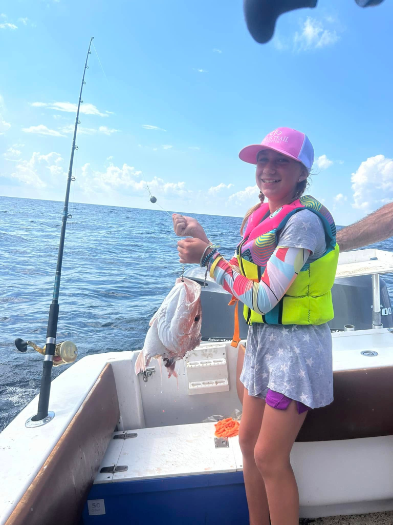 Young angler fishing offshore